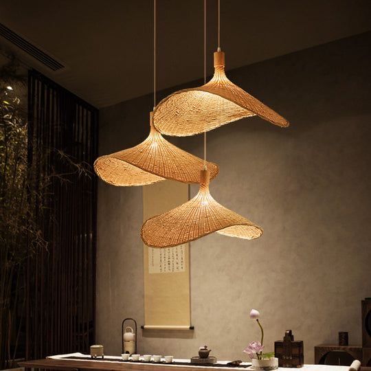 Sculptural bamboo pendants above a tea table
