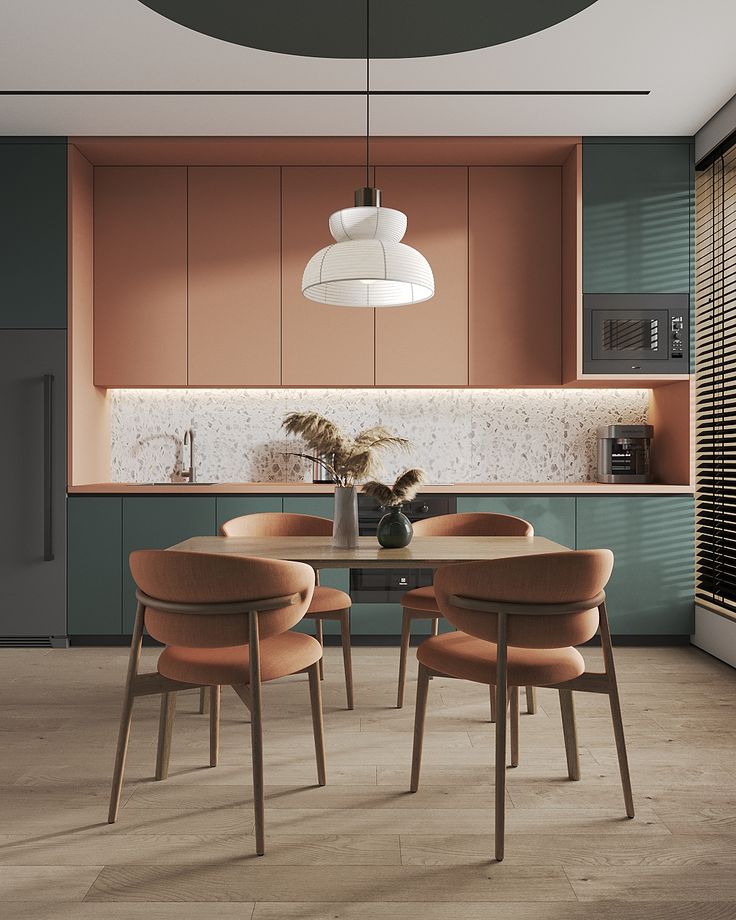 A kitchen in clay and teal with a terrazzo splashback