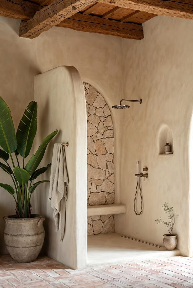A shower niche clad in rough stone